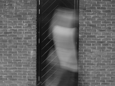 A person in motion captured with a blurred effect.