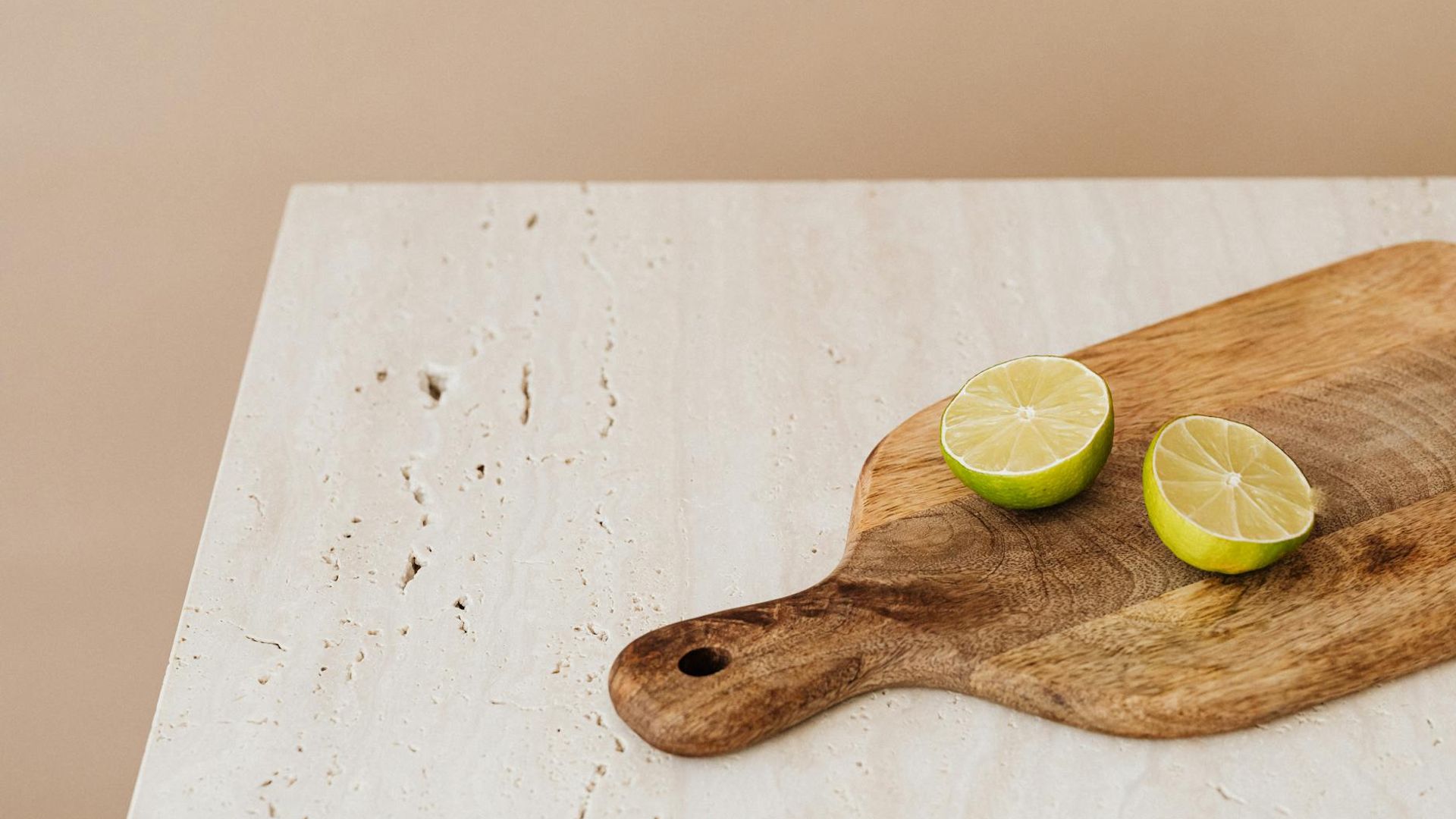 Active person moving in a dark minimalist studio with lime lighting.