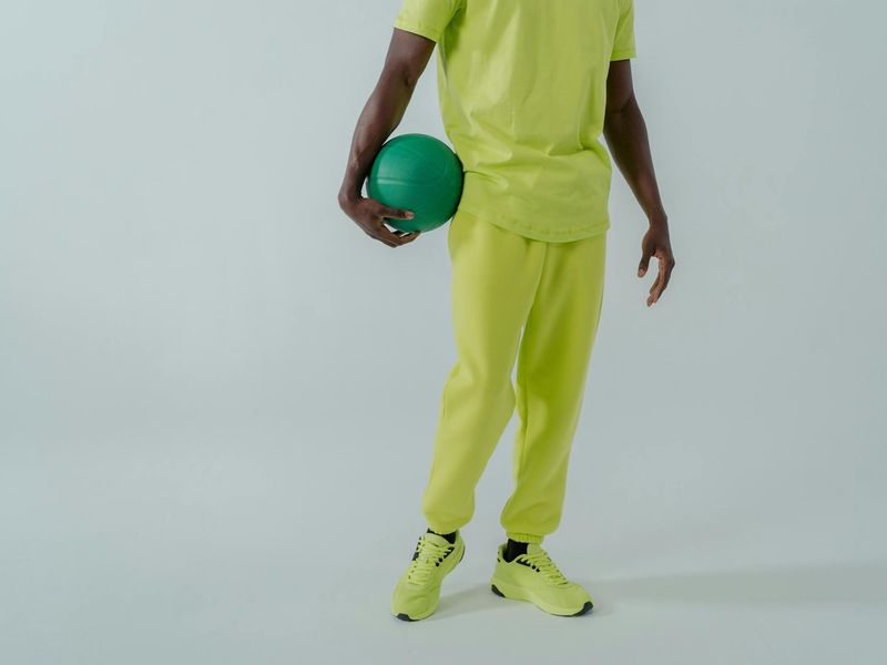 Minimalist fitness studio interior with neon lime light accents.